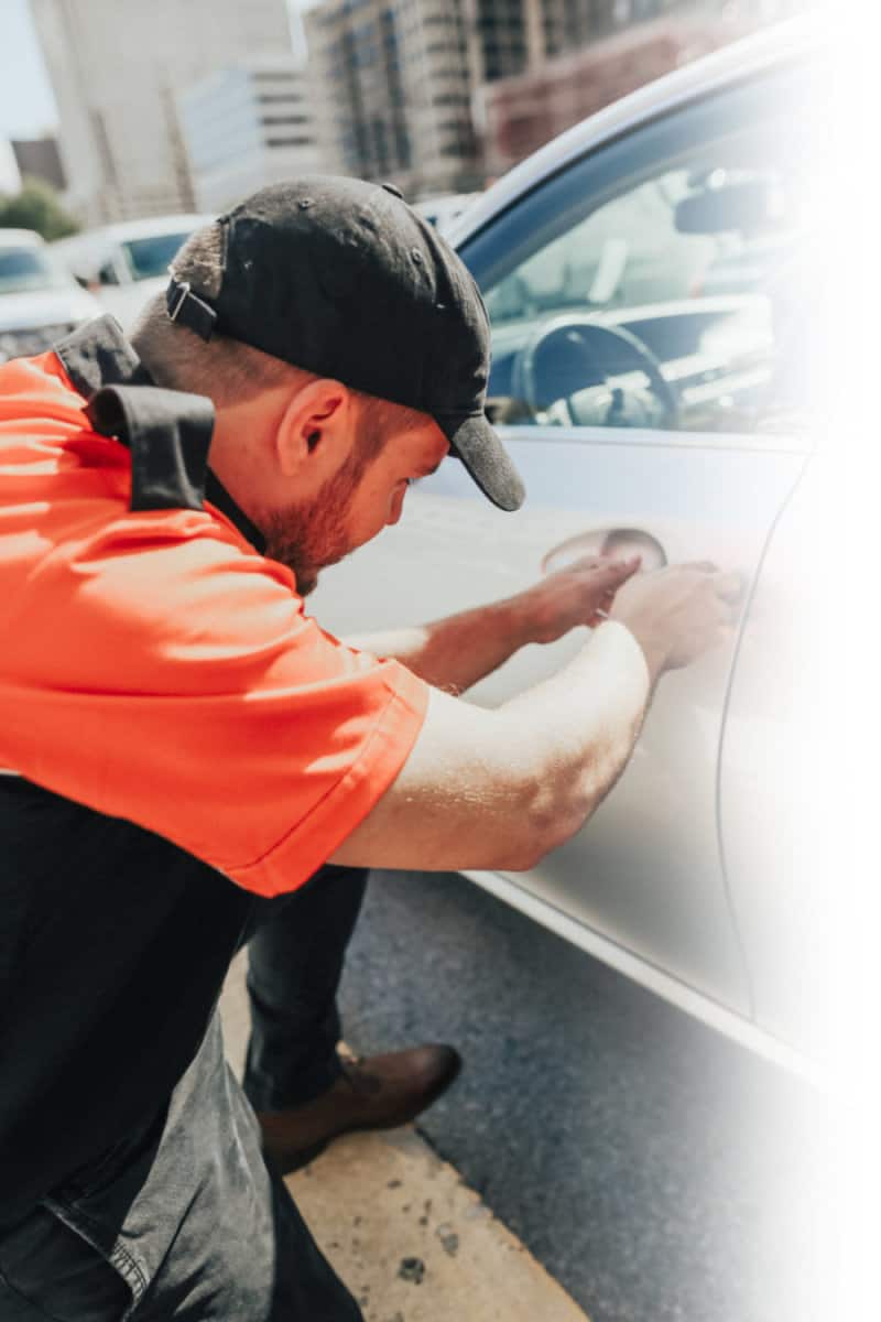 Pop-A-Lock Locksmith Technician Unlocking Car Door