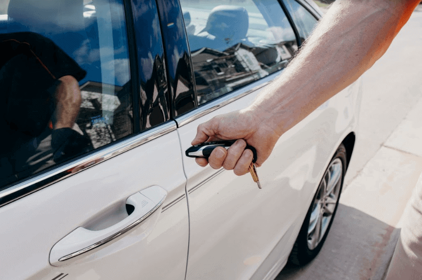 Public Awareness-2 man unlocking car with key fob