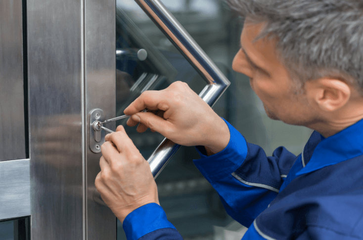 locksmith technician picking a door lock