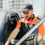 Pop-A-Lock technician working on a car