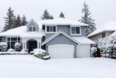 A house blanketed in snow.