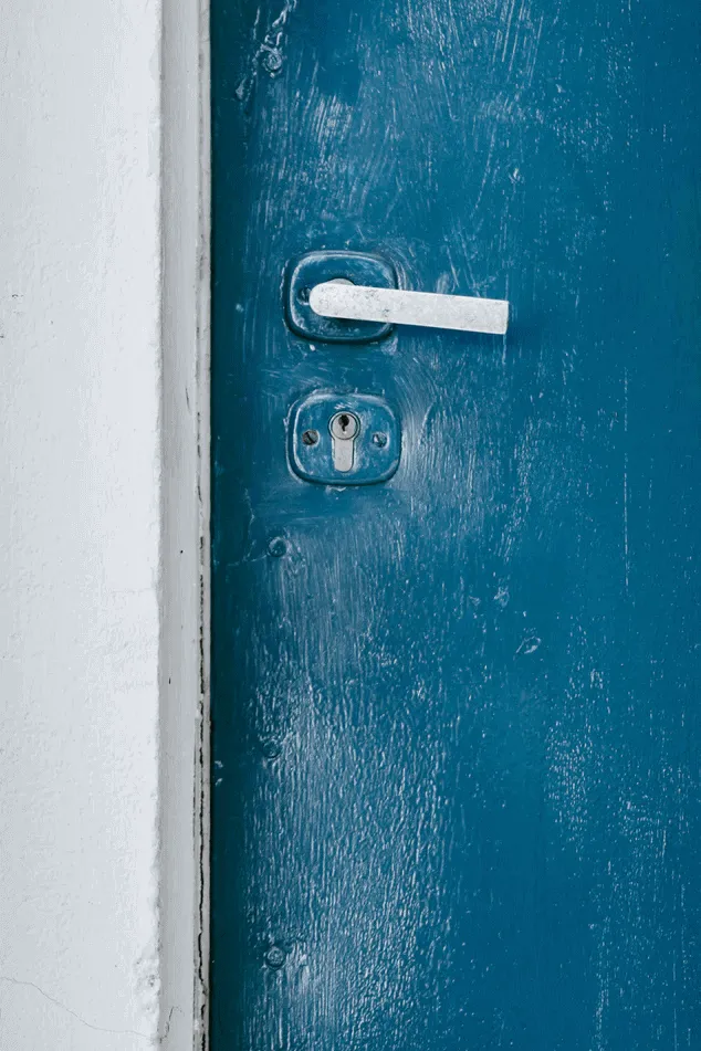 A closed blue door.