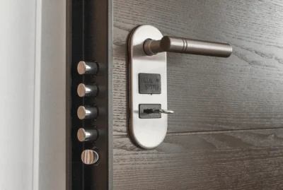 Open door with several deadbolt pins on the side.