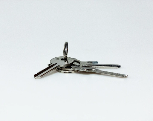 A set of metal keys on a keyring.