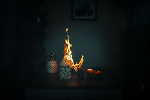 A small, accidental fire caused by a lit candle.