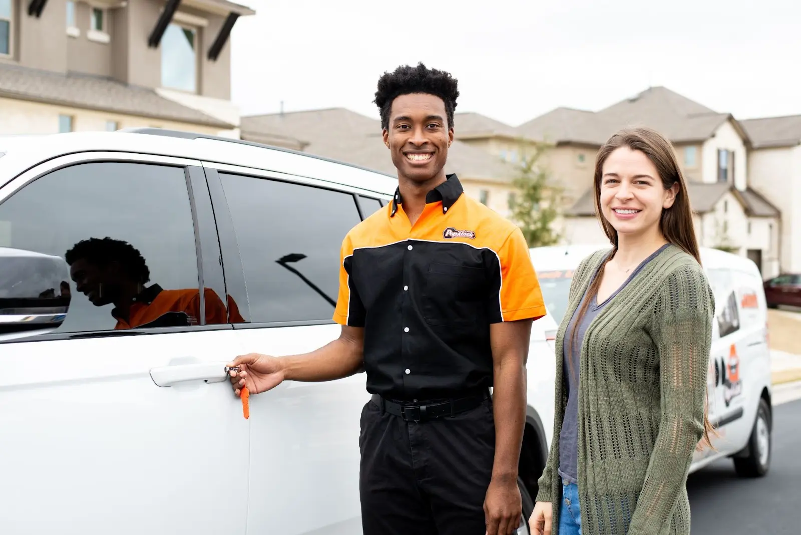 Pop-A-Lock Hammond auto locksmith technician unlocking customer’s door.