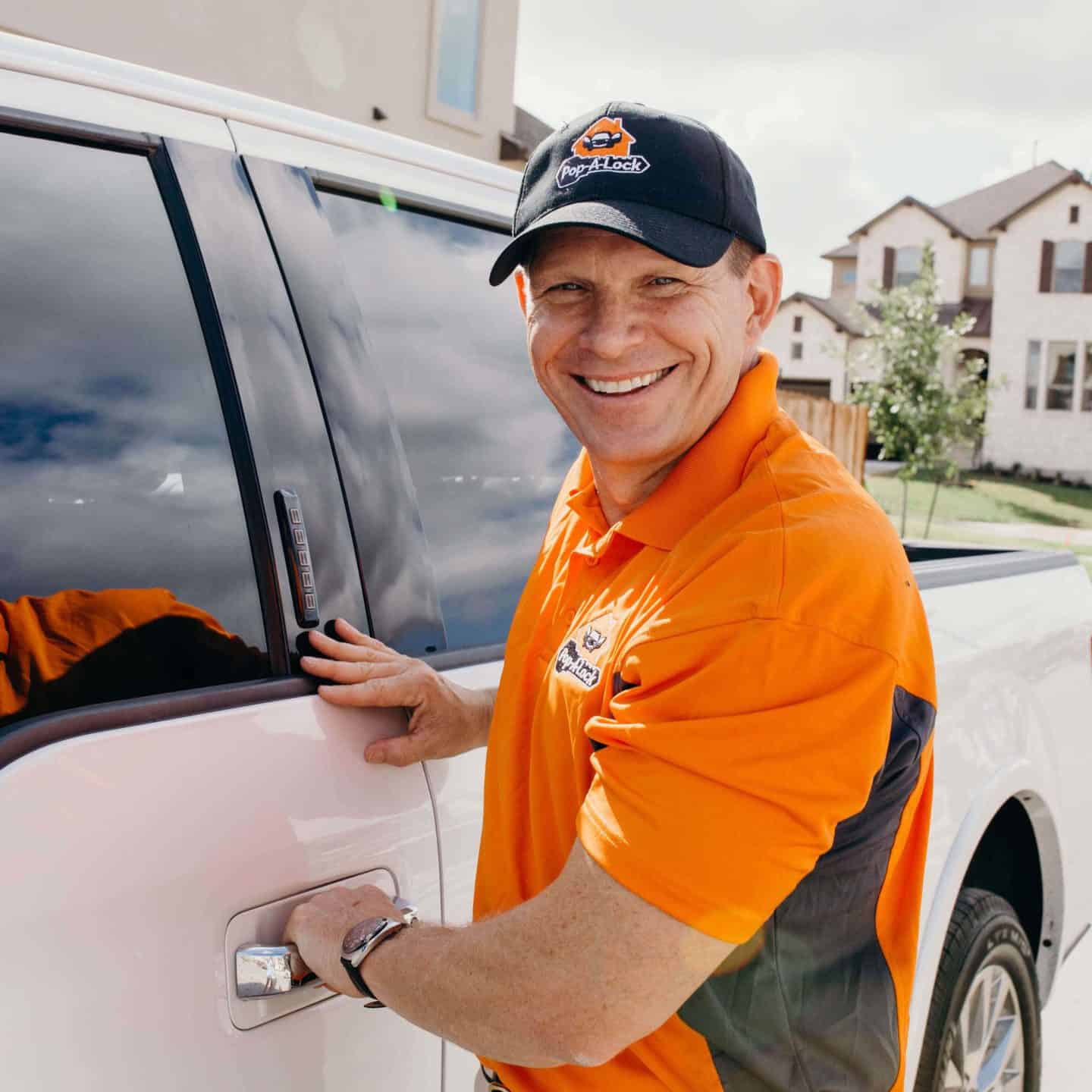 Key fob locked in a car, with a professional from Pop-A-Lock in Houston assisting to unlock the vehicle.