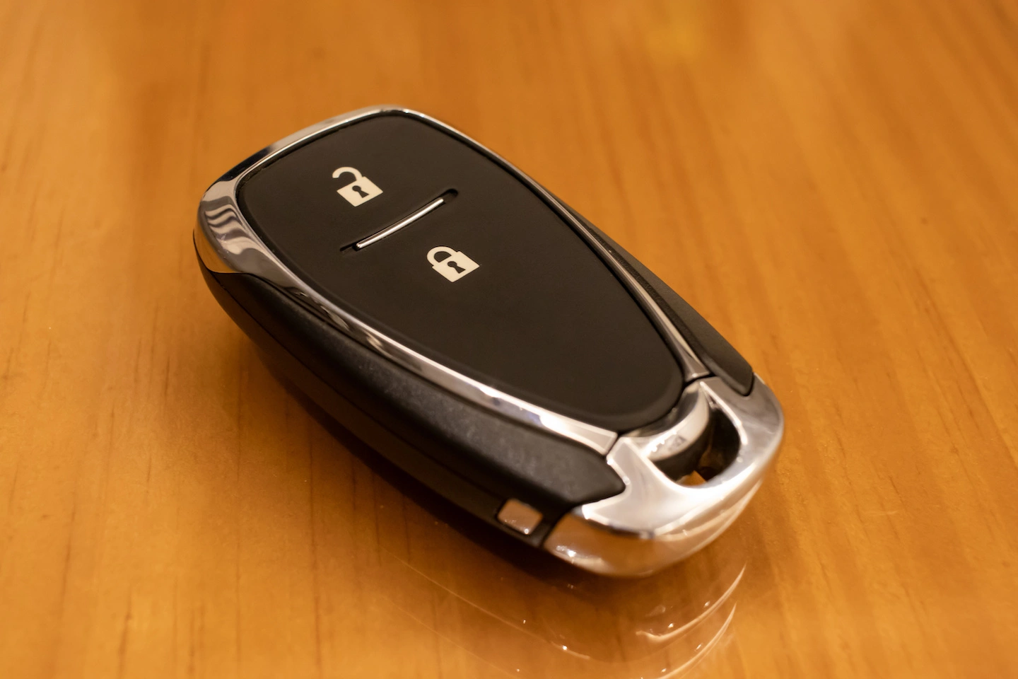 Black key fob with an unlock button and lock button.