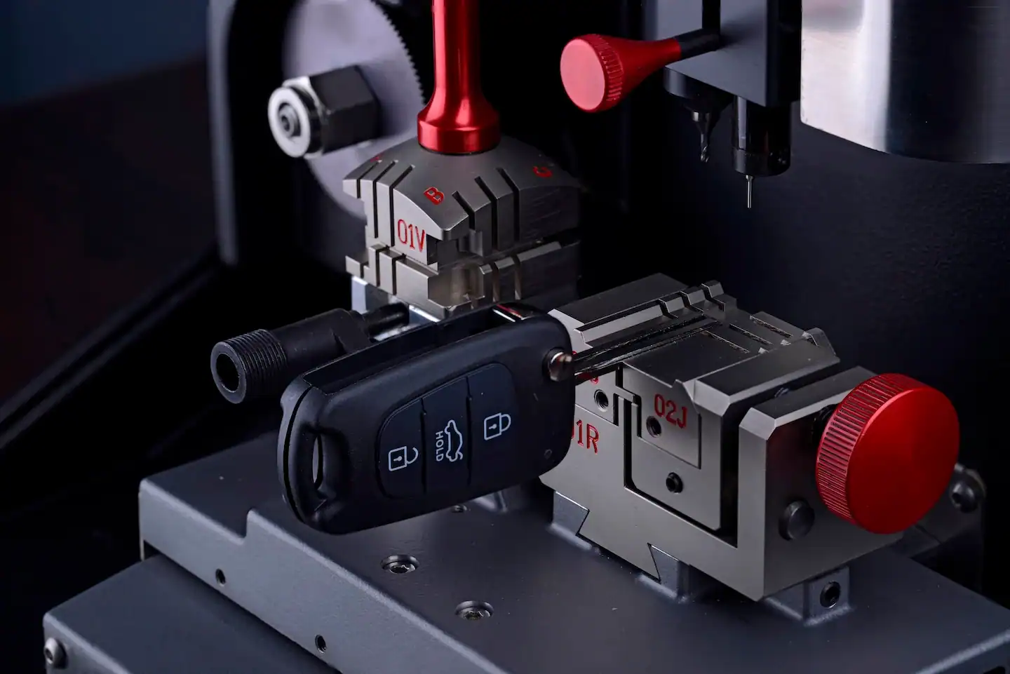 Close up view of a car key replacement being made. 